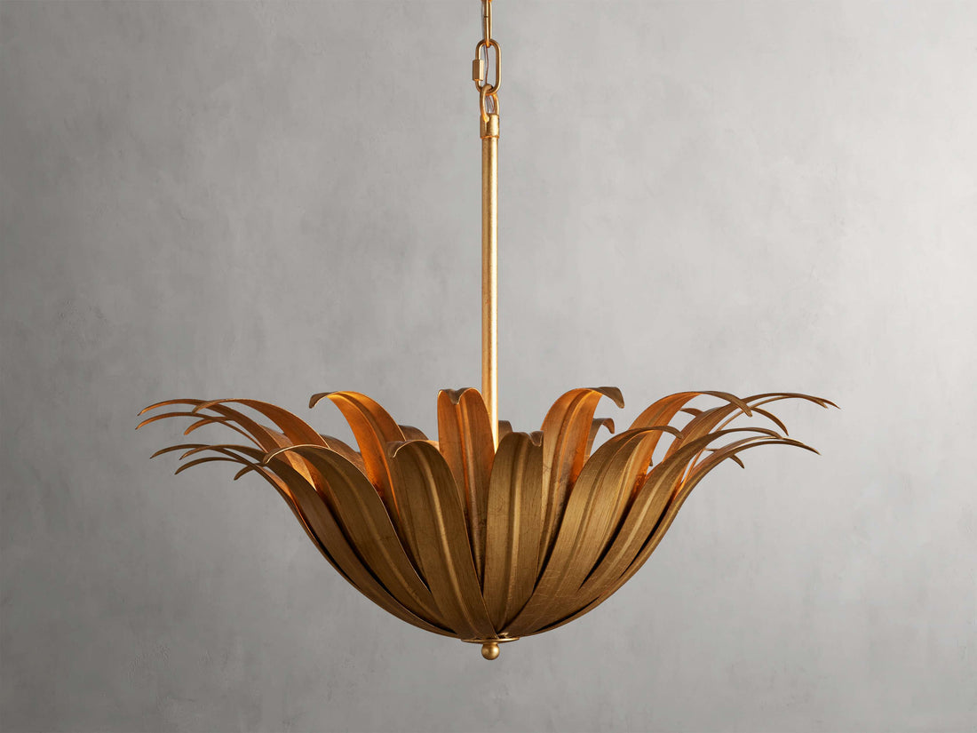 Matilde Pendant with antique-gold finish, features layered petal-like iron design. Hangs from a chain and rod, providing an elegant look.