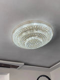 https://cdn.shopify.com/s/files/1/0736/8795/7790/files/extra-large-three-layers-round-luxury-flush-mounted-crystal-chandelier-for-living-room-merlin-lamps-3.webp?v=1767749030