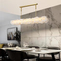 Carlos Alabaster Modern Snowflake Linear Chandelier Over Dining Table chandelier Kevin Studio Inc