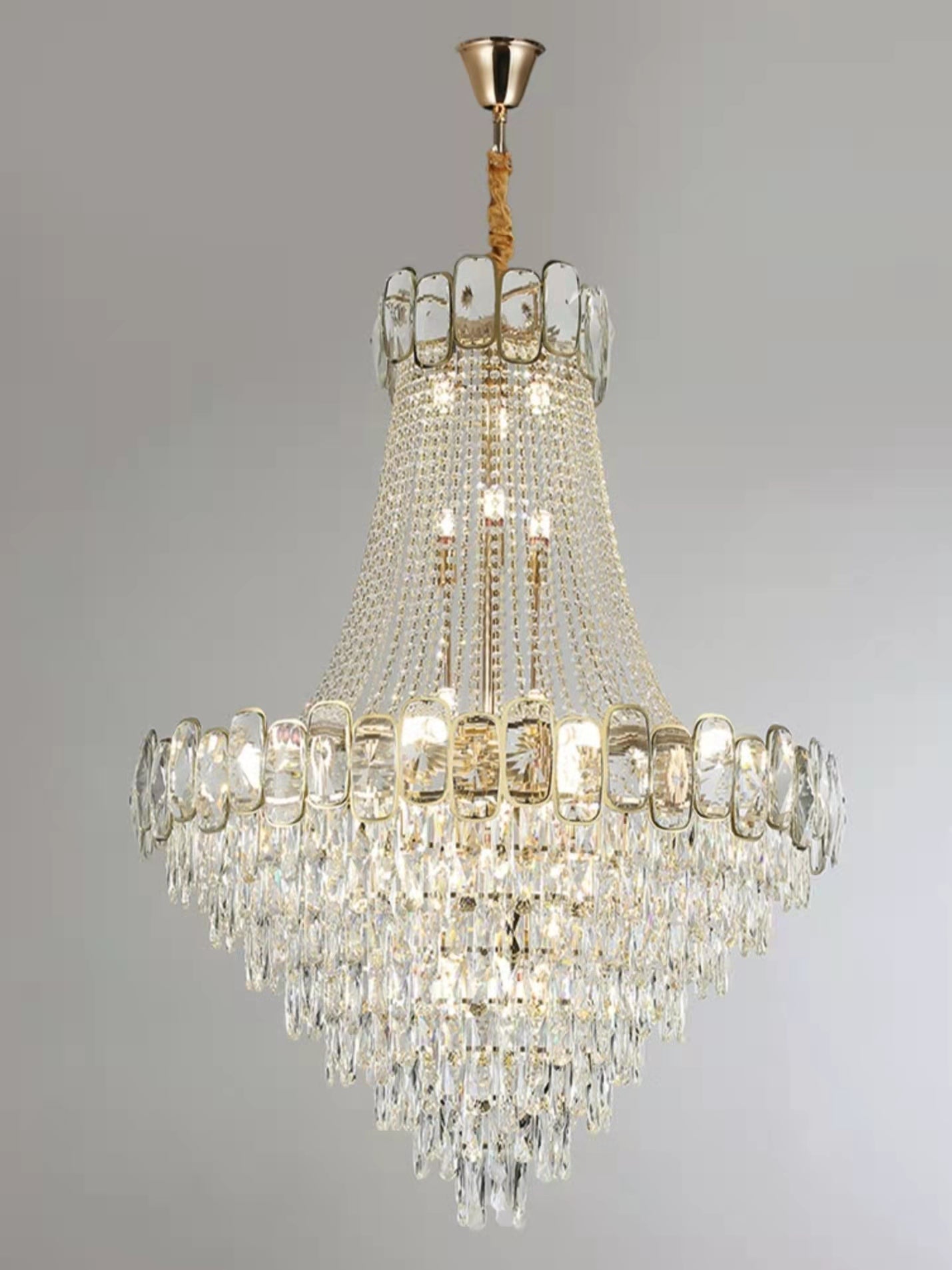 https://cdn.shopify.com/s/files/1/0736/8795/7790/files/foyer-staircase-chandelier-luxury-k9-crystal-ceiling-light-for-living-room-hallway-merlin-lamps-7.jpg?v=1765361008