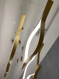 https://cdn.shopify.com/s/files/1/0736/8795/7790/files/modern-simple-brass-waving-chandelier-for-livingdining-roomkitchen-island-merlin-lamps-12.jpg?v=1765407446