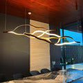 https://cdn.shopify.com/s/files/1/0736/8795/7790/files/modern-simple-brass-waving-chandelier-for-livingdining-roomkitchen-island-merlin-lamps-16.jpg?v=1765407454