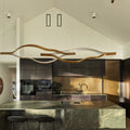 https://cdn.shopify.com/s/files/1/0736/8795/7790/files/modern-simple-brass-waving-chandelier-for-livingdining-roomkitchen-island-merlin-lamps-19.jpg?v=1765407459