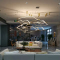 https://cdn.shopify.com/s/files/1/0736/8795/7790/files/modern-simple-brass-waving-chandelier-for-livingdining-roomkitchen-island-merlin-lamps-3.jpg?v=1767690874