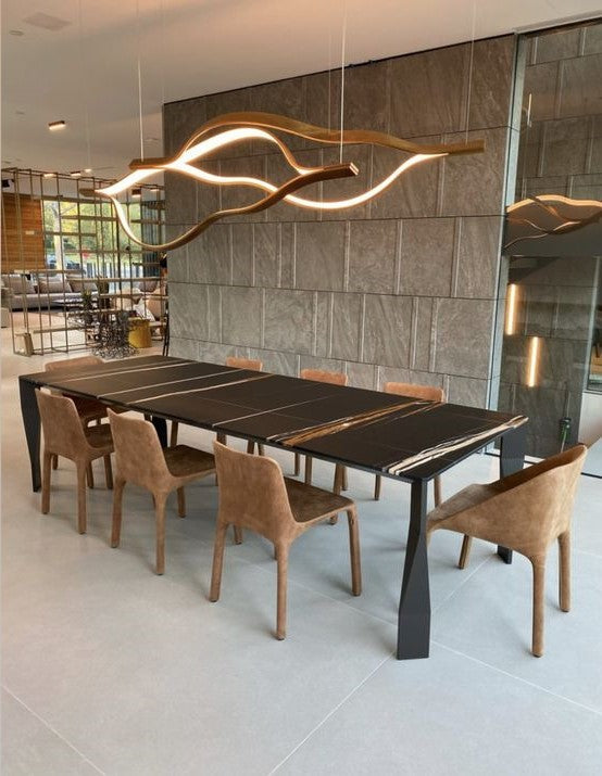 https://cdn.shopify.com/s/files/1/0736/8795/7790/files/modern-simple-brass-waving-chandelier-for-livingdining-roomkitchen-island-merlin-lamps-4.jpg?v=1765407431