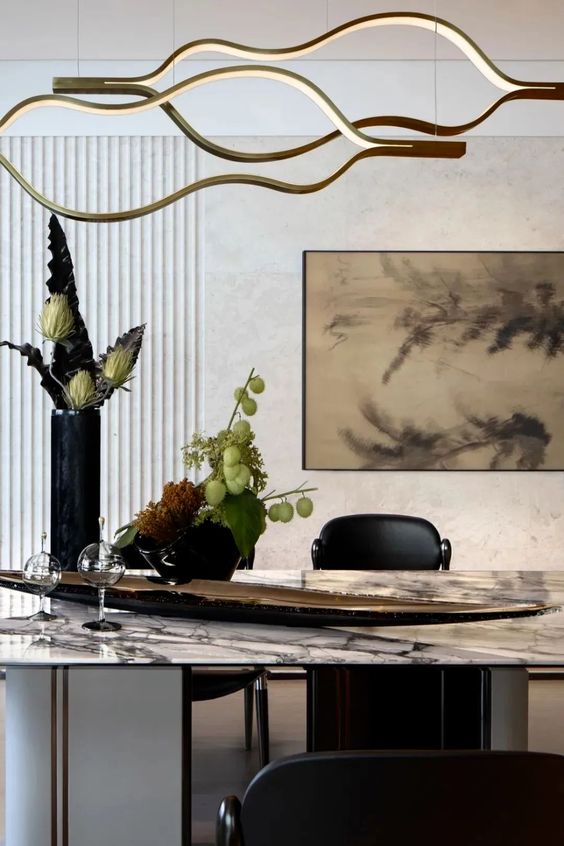https://cdn.shopify.com/s/files/1/0736/8795/7790/files/modern-simple-brass-waving-chandelier-for-livingdining-roomkitchen-island-merlin-lamps-5.jpg?v=1765407433