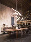 https://cdn.shopify.com/s/files/1/0736/8795/7790/files/modern-simple-brass-waving-chandelier-for-livingdining-roomkitchen-island-merlin-lamps-8.jpg?v=1765407439