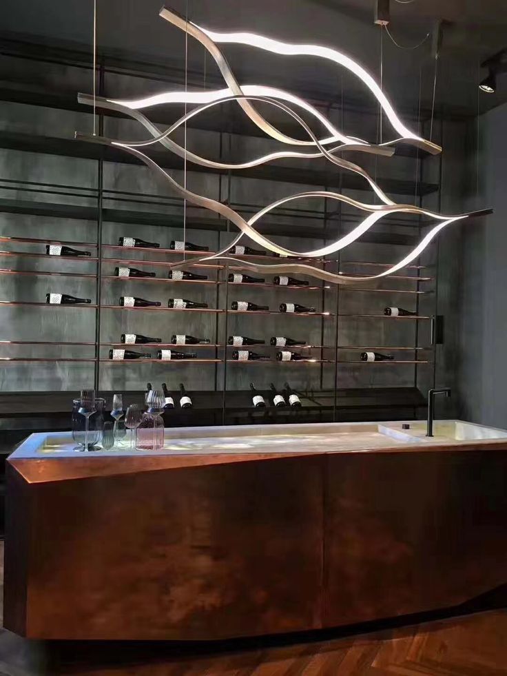 https://cdn.shopify.com/s/files/1/0736/8795/7790/files/modern-simple-brass-waving-chandelier-for-livingdining-roomkitchen-island-merlin-lamps-9.jpg?v=1765407440