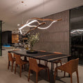 https://cdn.shopify.com/s/files/1/0736/8795/7790/files/modern-simple-brass-waving-chandelier-for-livingdining-roomkitchen-island-merlin-lamps.jpg?v=1767690874
